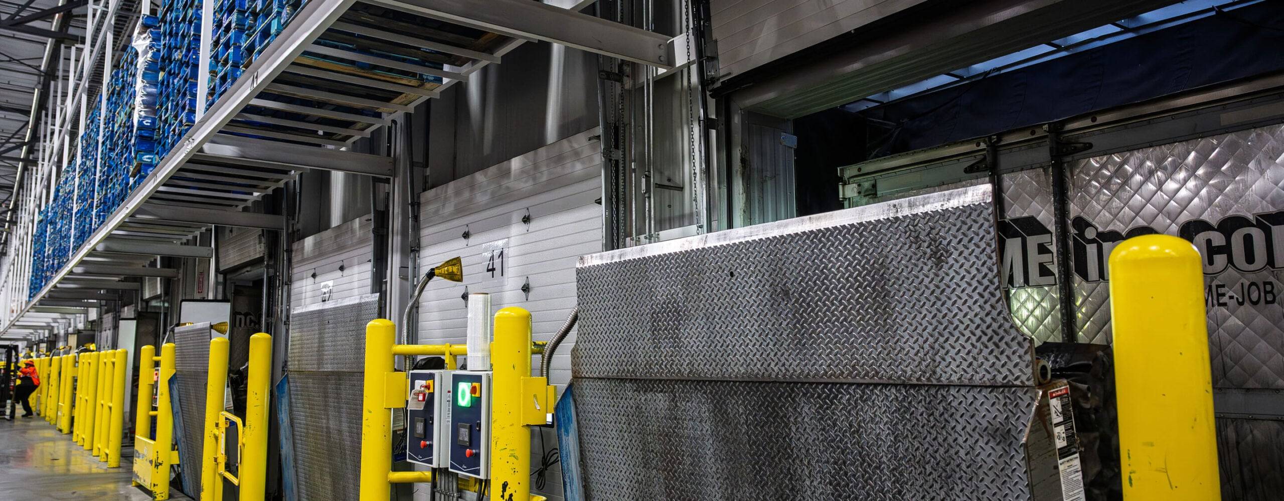 Industrial warehouse with safety bollards and loading dock doors