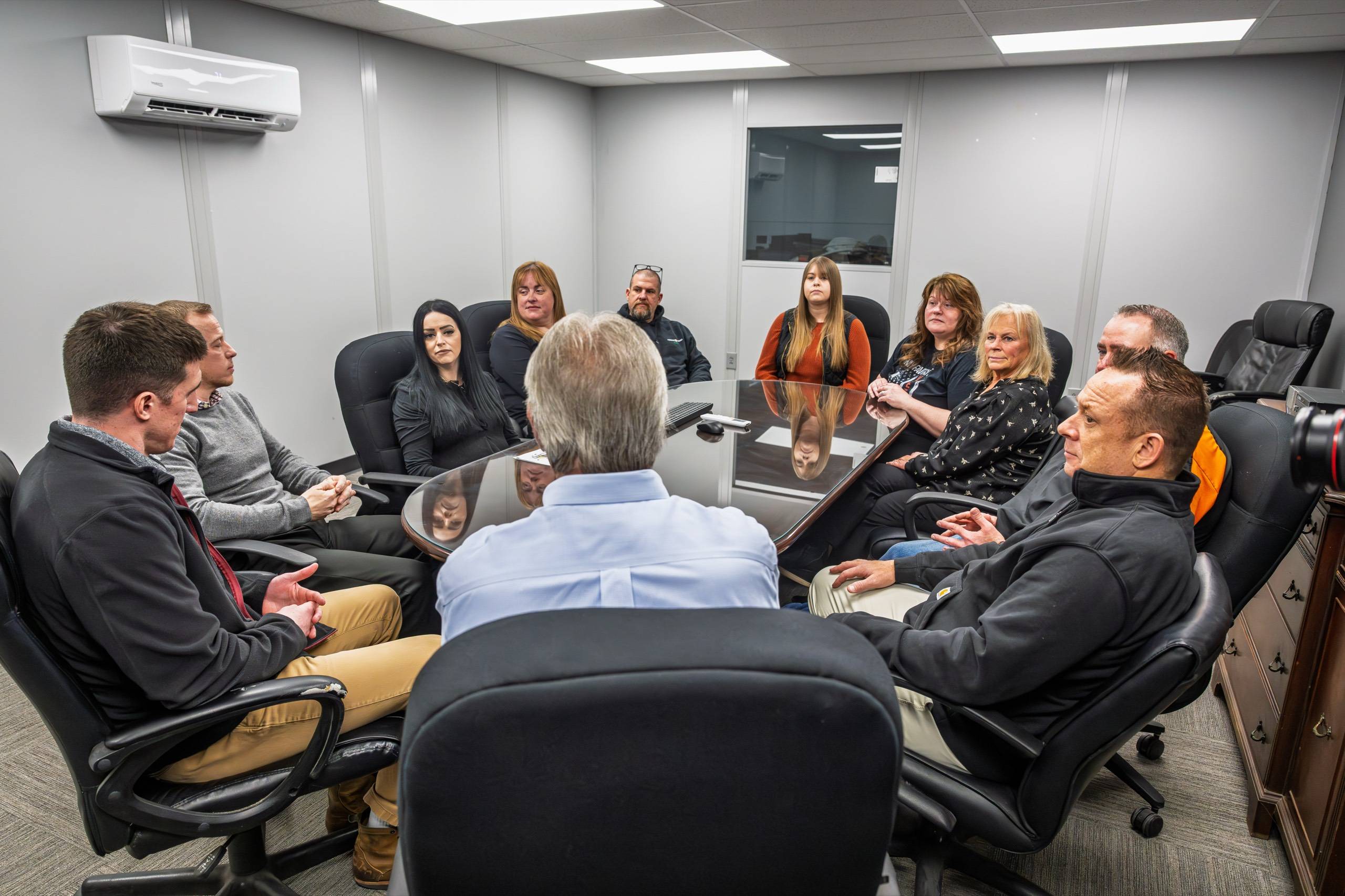 Timbers-Kovar team meeting around a conference table