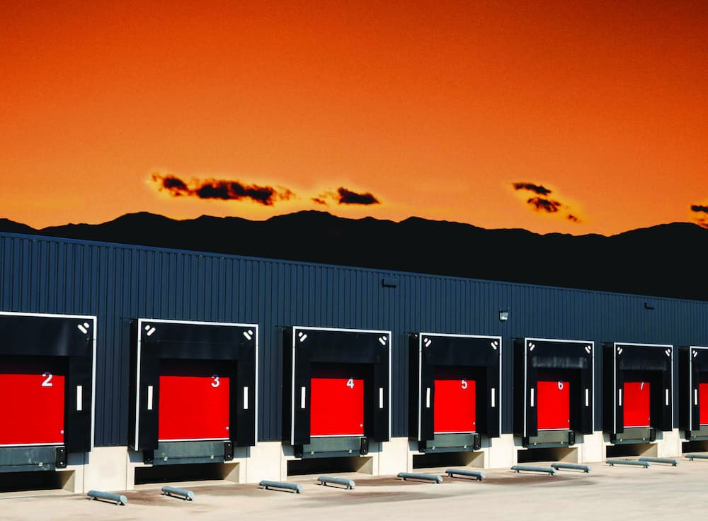 Red door loading bays during sunset